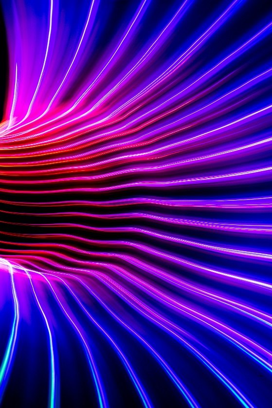 Abstract streaks of light in motion, representing momentum